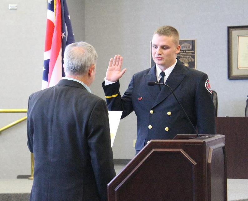 Matt Poppe being sworn in as Lt. by Mayor Marc Sirkin